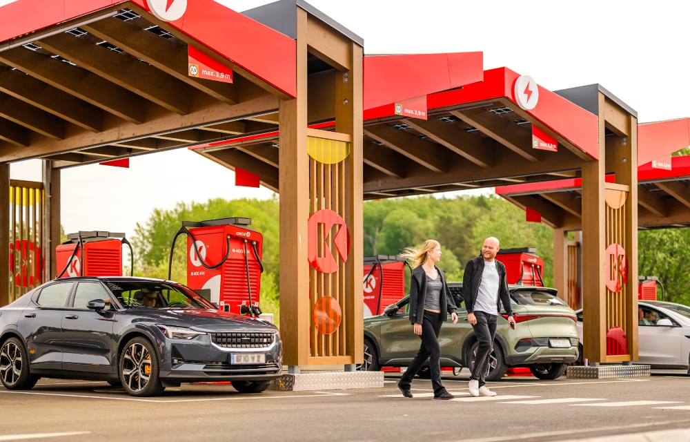 picture of EV Chargers and two customers