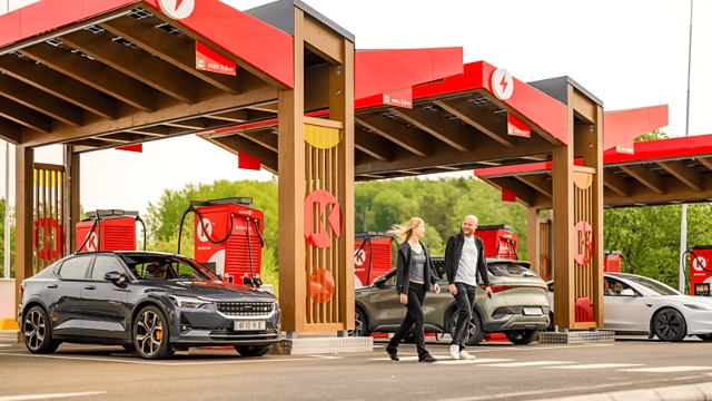 picture of ev chargers and two customers
