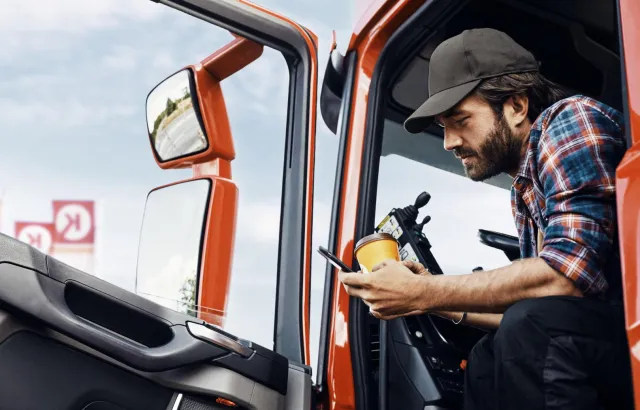 Man on his phone stationary in his truck