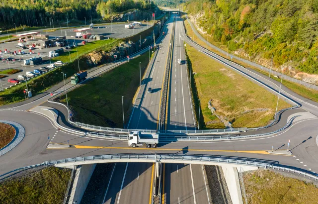 Aerial view of truck driving along motorway crossroads